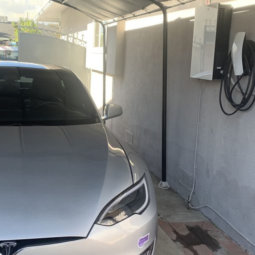 Level 2 EV charger mounted outdoors with conduit run